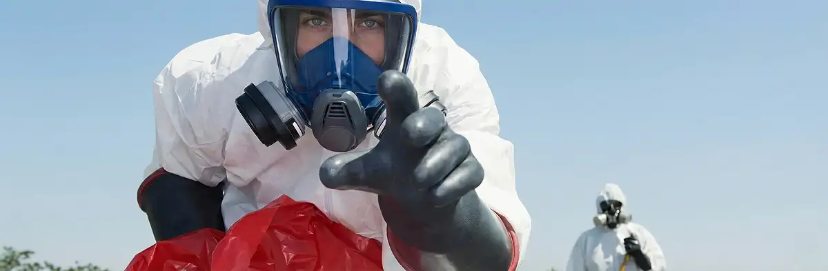 sewage clean up technician wearing protective gear handling biohazard materials in Salt Lake City, UT