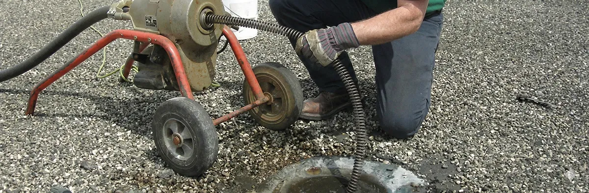 sewer rodding technician actively removing blockages from a sewer line in Salt Lake City, UT